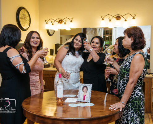 Bride toasting with her sisters on her wedding day