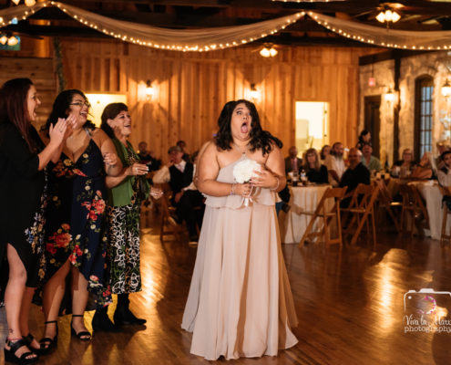 Bridesmaid catches bouquet at The Springs Event Venue