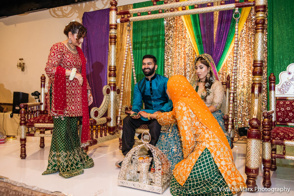 Feeding bride and groom at Houston Pakistani Wedding