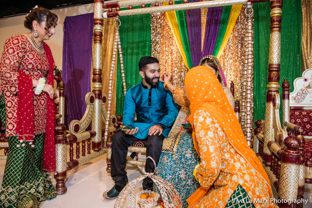 Feeding the groom at Pakistani Houston Wedding