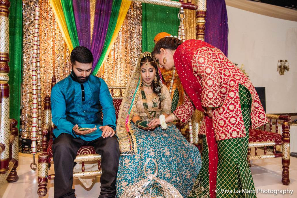 Feeding the wedding couple at Houston Pakistani Wedding