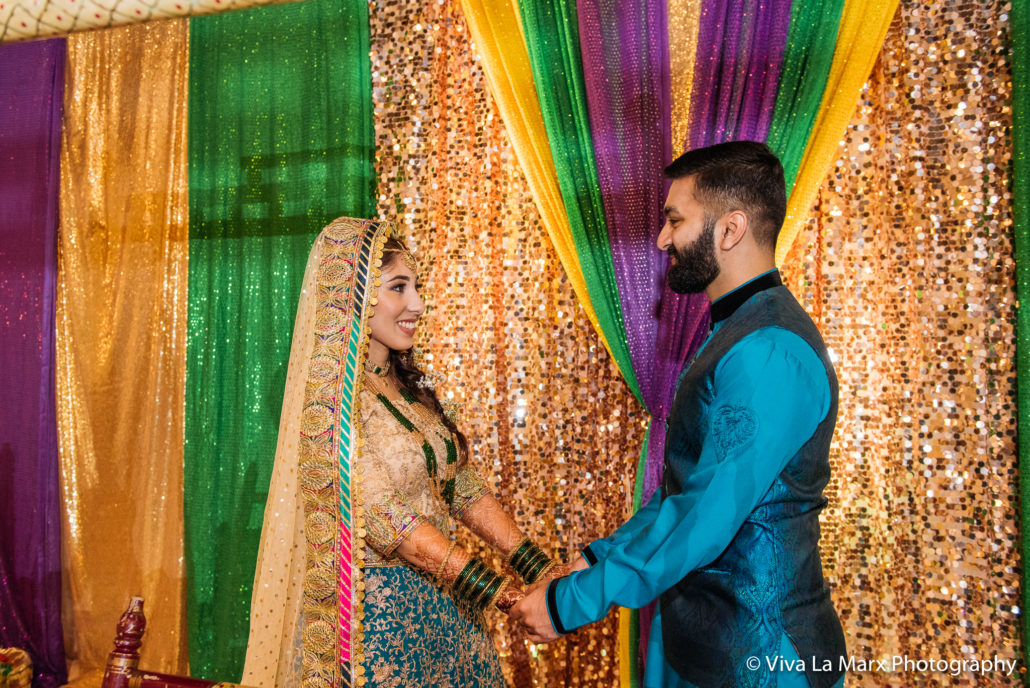 Looking at each other at Houston Pakistani Wedding
