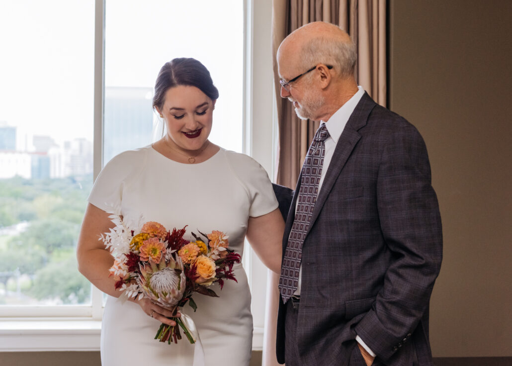 dad and daughter first look at wedding